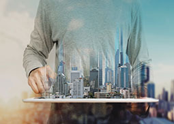 A person holding New York City and its blended